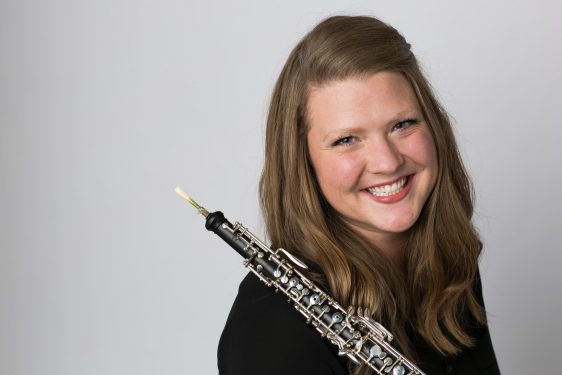 Lindsay Flowers' profile picture. A woman with long, light-brown hair holds an oboe and smiles at the camera.