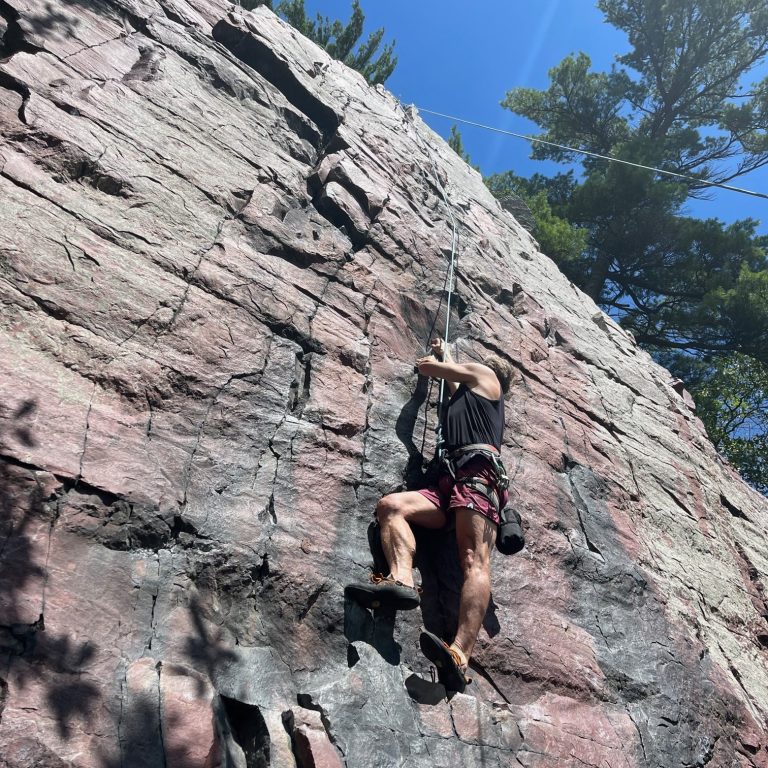 Buzz Kemper climbing Errol's Wall at Devil's Lake State Park.